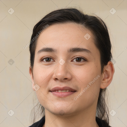 Joyful white young-adult female with short  brown hair and brown eyes