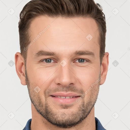 Joyful white young-adult male with short  brown hair and grey eyes