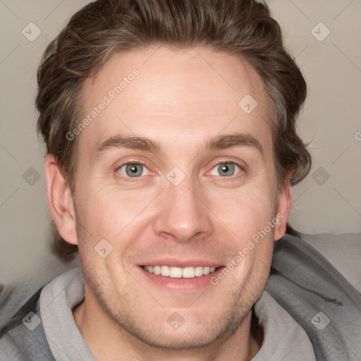 Joyful white adult male with short  brown hair and grey eyes