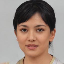 Joyful asian young-adult female with medium  black hair and brown eyes