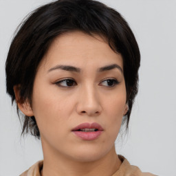 Neutral asian young-adult female with medium  brown hair and brown eyes