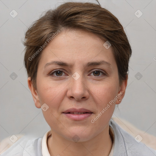 Joyful white adult female with short  brown hair and grey eyes