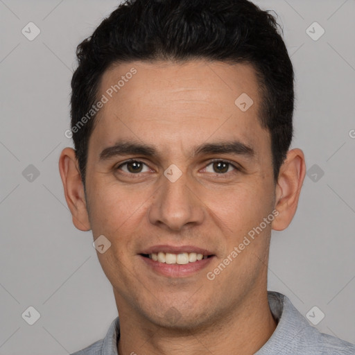 Joyful white young-adult male with short  black hair and brown eyes