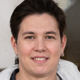 Joyful white adult male with short  brown hair and brown eyes