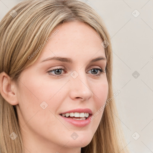 Joyful white young-adult female with long  brown hair and blue eyes