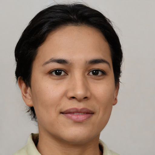 Joyful asian young-adult female with medium  brown hair and brown eyes