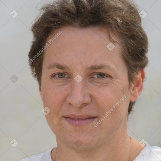 Joyful white adult female with short  brown hair and brown eyes