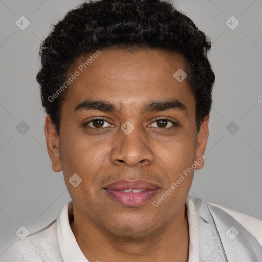 Joyful black young-adult male with short  black hair and brown eyes