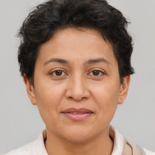Joyful white adult female with short  brown hair and brown eyes