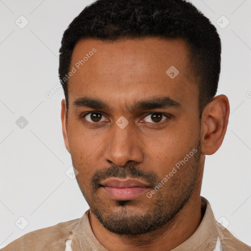 Neutral latino young-adult male with short  black hair and brown eyes