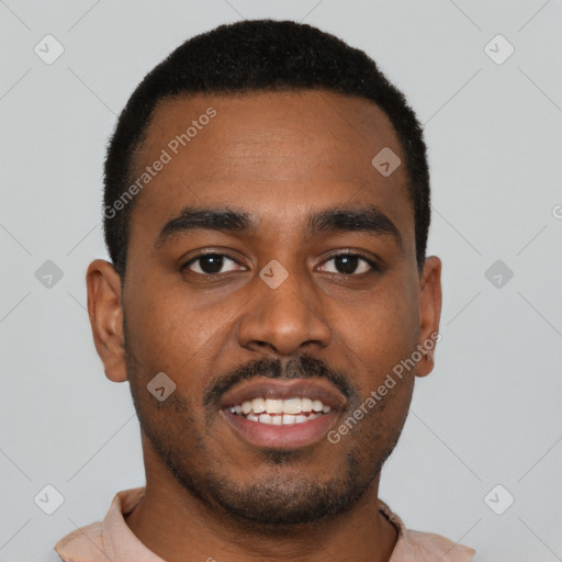 Joyful black young-adult male with short  black hair and brown eyes