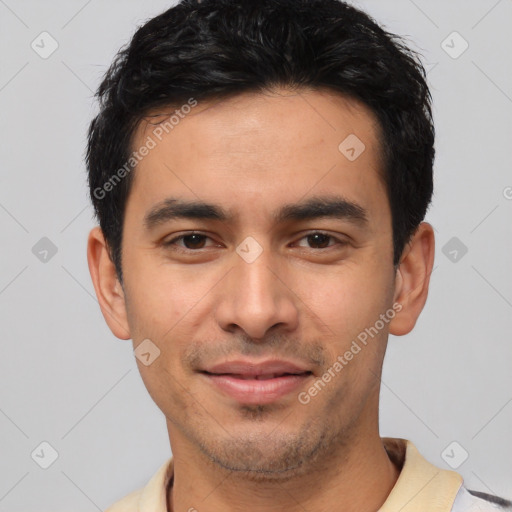 Joyful white young-adult male with short  black hair and brown eyes