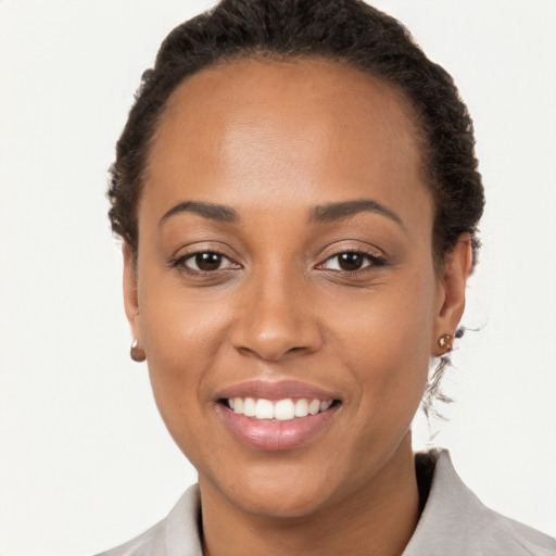 Joyful latino young-adult female with short  brown hair and brown eyes