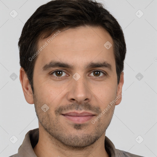 Joyful white young-adult male with short  brown hair and brown eyes