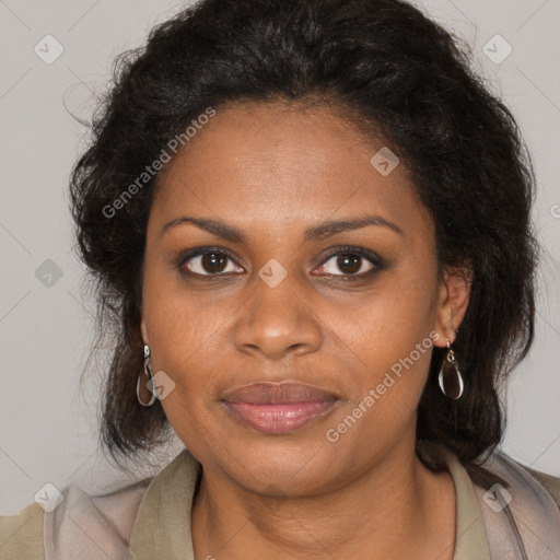 Joyful black young-adult female with long  brown hair and brown eyes