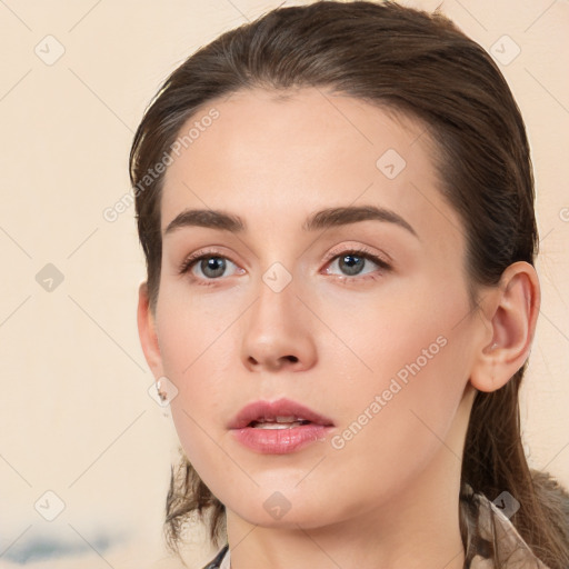 Neutral white young-adult female with long  brown hair and brown eyes