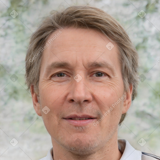 Joyful white adult male with short  brown hair and grey eyes