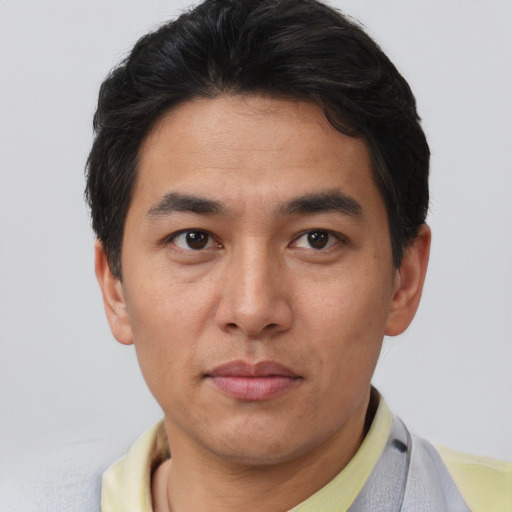 Neutral asian young-adult male with short  brown hair and brown eyes