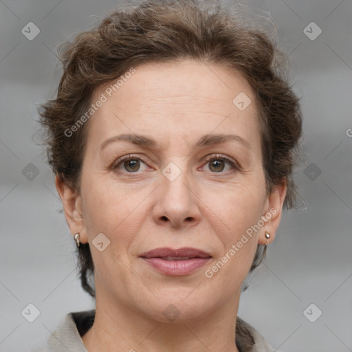 Joyful white adult female with short  brown hair and grey eyes