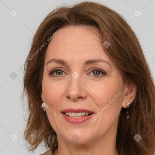 Joyful white adult female with long  brown hair and brown eyes