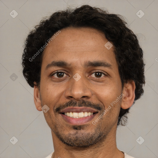 Joyful black young-adult male with short  brown hair and brown eyes