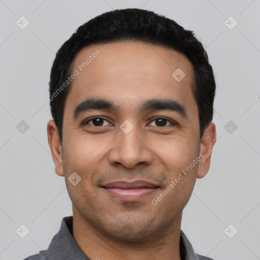 Joyful latino young-adult male with short  black hair and brown eyes