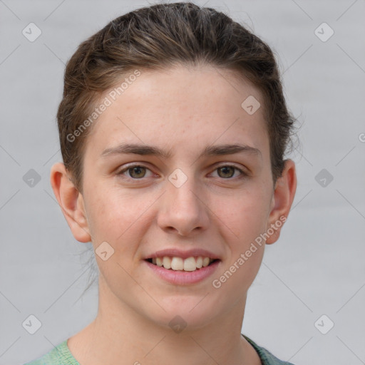 Joyful white young-adult female with short  brown hair and grey eyes