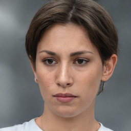 Neutral white young-adult female with short  brown hair and brown eyes