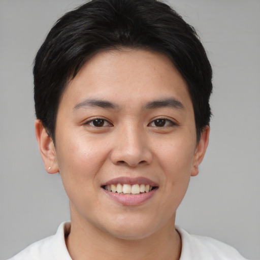 Joyful asian young-adult female with short  brown hair and brown eyes