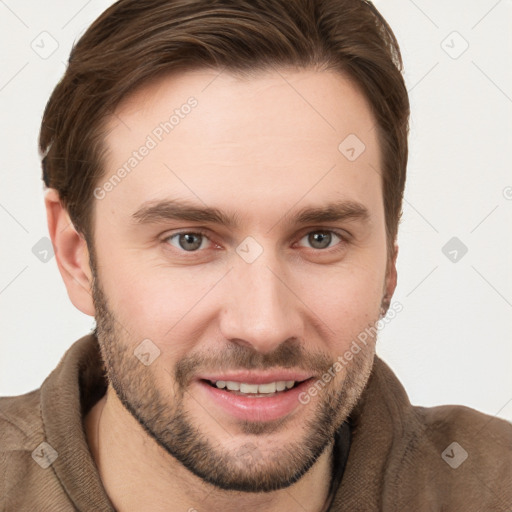 Joyful white young-adult male with short  brown hair and grey eyes