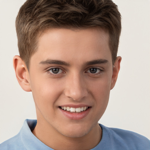 Joyful white child male with short  brown hair and brown eyes