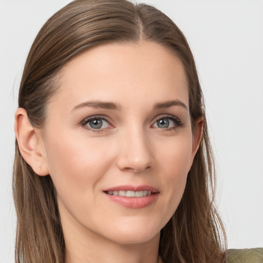 Joyful white young-adult female with long  brown hair and grey eyes