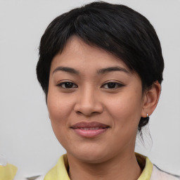 Joyful asian young-adult female with medium  brown hair and brown eyes