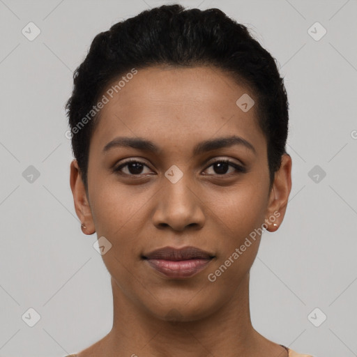 Joyful latino young-adult female with short  black hair and brown eyes