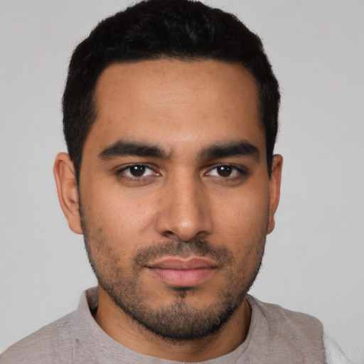 Neutral latino young-adult male with short  black hair and brown eyes