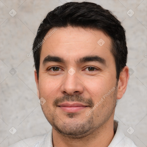 Joyful white young-adult male with short  black hair and brown eyes