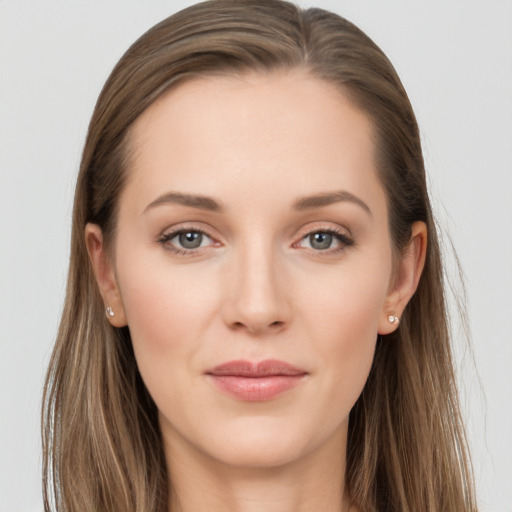 Joyful white young-adult female with long  brown hair and grey eyes