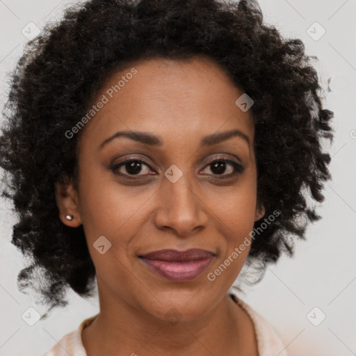 Joyful black adult female with medium  brown hair and brown eyes