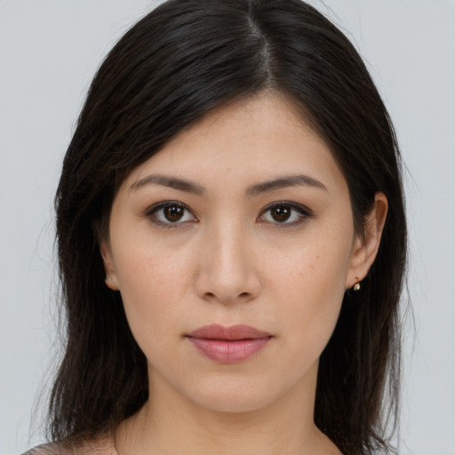 Joyful white young-adult female with long  brown hair and brown eyes