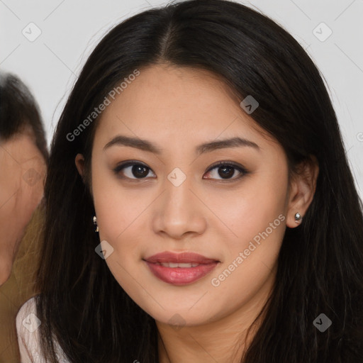 Joyful asian young-adult female with long  brown hair and brown eyes