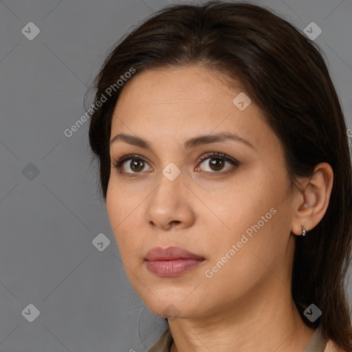 Neutral white young-adult female with long  brown hair and brown eyes