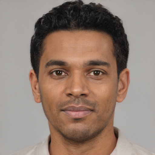 Neutral black young-adult male with short  black hair and brown eyes