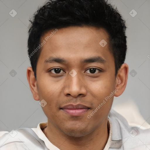 Joyful latino young-adult male with short  brown hair and brown eyes