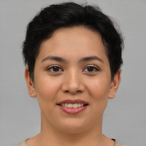 Joyful latino young-adult female with short  brown hair and brown eyes