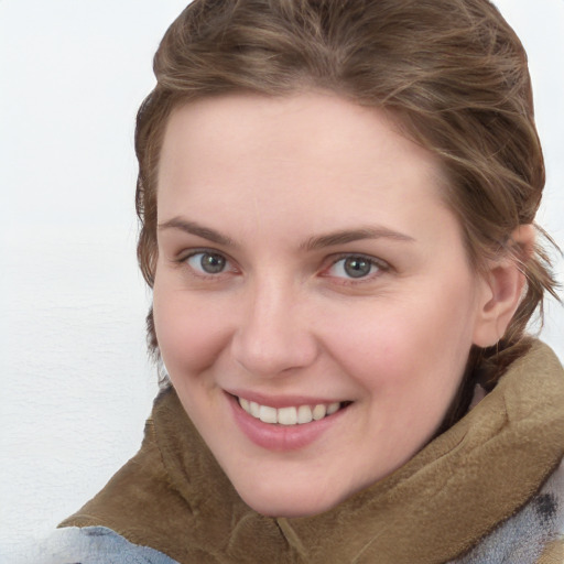 Joyful white young-adult female with medium  brown hair and blue eyes