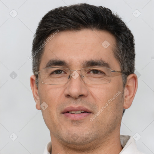 Joyful white adult male with short  brown hair and brown eyes