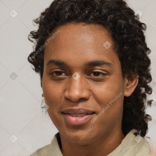 Joyful black young-adult male with short  brown hair and brown eyes