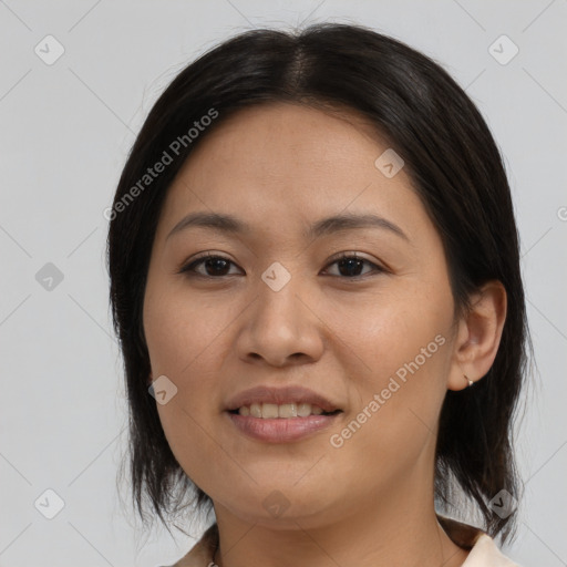 Joyful asian young-adult female with medium  brown hair and brown eyes