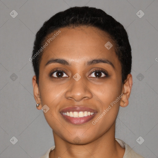 Joyful black young-adult female with short  black hair and brown eyes