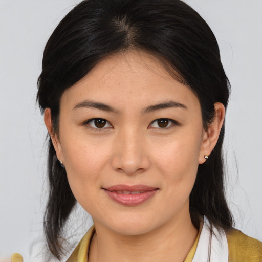Joyful asian young-adult female with medium  brown hair and brown eyes